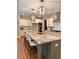 Gourmet kitchen with a large island, modern appliances, and stylish pendant lighting at 101 Red Oak Ln, Carrollton, GA 30116