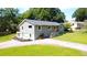 Exterior of the house featuring well-maintained landscaping and a long driveway at 1042 Oakdale Se Dr, Smyrna, GA 30080
