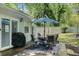 Outdoor patio with table and chairs offering a comfortable space for relaxation at 200 Robin Hood Ln, Hampton, GA 30228