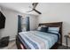 Comfortable bedroom with ceiling fan, and natural light from the window at 200 Robin Hood Ln, Hampton, GA 30228