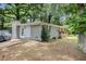 Charming home exterior featuring a brick facade, inviting entrance, and well-maintained yard at 200 Robin Hood Ln, Hampton, GA 30228