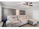 Comfortable living room with luxury vinyl plank flooring, painted brick and oversized sectional sofa at 200 Robin Hood Ln, Hampton, GA 30228