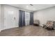 Inviting room featuring new laminate flooring, fresh paint, and plenty of natural light at 200 Robin Hood Ln, Hampton, GA 30228