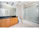 Modern bathroom featuring a glass-enclosed shower, vanity with sink, and tile flooring at 3657 Peachtree Ne Rd # 4A, Atlanta, GA 30319