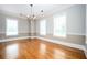 Bright dining room with hardwood floors, wainscoting detail, and chandelier lighting fixture at 3657 Peachtree Ne Rd # 4A, Atlanta, GA 30319