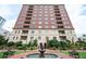 Beautiful brick apartment building with manicured landscaping and a water fountain in the front at 3657 Peachtree Ne Rd # 4A, Atlanta, GA 30319