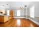 Spacious kitchen and dining area with light wood cabinets, hardwood floors, and natural light at 3657 Peachtree Ne Rd # 4A, Atlanta, GA 30319