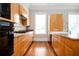Well-lit kitchen features wood cabinets, granite countertops, and stainless steel appliances at 3657 Peachtree Ne Rd # 4A, Atlanta, GA 30319
