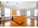 Open kitchen and dining area with wood cabinets, granite countertops, and stainless steel dishwasher at 3657 Peachtree Ne Rd # 4A, Atlanta, GA 30319