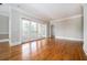 Living room boasting hardwood flooring, French doors to the balcony and soft gray walls at 3657 Peachtree Ne Rd # 4A, Atlanta, GA 30319