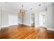 Spacious living room with hardwood floors and access to other rooms at 3657 Peachtree Ne Rd # 4A, Atlanta, GA 30319