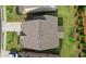 Aerial view of the home showcasing the roof, lawn, driveway, and landscaping of the property at 3860 Oxford Park Ln, Cumming, GA 30040