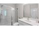 Modern bathroom featuring a glass shower, white cabinets, and tile at 3860 Oxford Park Ln, Cumming, GA 30040