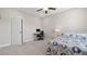 Bedroom featuring a desk and chair, bed, and overhead ceiling fan at 3860 Oxford Park Ln, Cumming, GA 30040