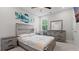 Neutral bedroom featuring a queen bed, full dresser, and hardwood floors at 3860 Oxford Park Ln, Cumming, GA 30040
