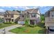 Landscaped front yard with a well-maintained lawn and mature tree at 3860 Oxford Park Ln, Cumming, GA 30040