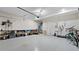 Garage featuring an epoxy floor, overhead storage and bike racks at 3860 Oxford Park Ln, Cumming, GA 30040