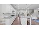 Spacious kitchen featuring granite countertops, white cabinets, and stainless steel appliances at 3860 Oxford Park Ln, Cumming, GA 30040