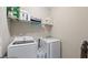 Bright laundry room featuring newer, front-load washer and dryer at 3860 Oxford Park Ln, Cumming, GA 30040
