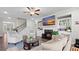 Comfortable living room with a fireplace, built-in shelves, and neutral decor at 3860 Oxford Park Ln, Cumming, GA 30040