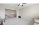 Upstairs loft featuring carpet flooring and an overlook to the downstairs at 3860 Oxford Park Ln, Cumming, GA 30040