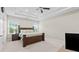 Large bedroom features a trey ceiling, ceiling fan, and dual windows providing natural light at 3860 Oxford Park Ln, Cumming, GA 30040