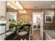 Bright bathroom with granite countertop, dual sinks, large mirror, and tile floors with an adjacent tub at 5110 Mulberry Pass Ct, Hoschton, GA 30548
