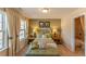 Cozy bedroom with natural light, neutral color palette, and en-suite bathroom access at 5110 Mulberry Pass Ct, Hoschton, GA 30548