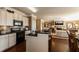 Modern kitchen with stainless steel appliances, granite countertops, and an open layout at 5110 Mulberry Pass Ct, Hoschton, GA 30548
