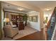 Inviting home office space featuring built-in bookcase, desk, and cozy seating area at 5110 Mulberry Pass Ct, Hoschton, GA 30548