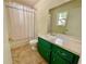 Bathroom featuring toilet, vanity, mirror and shower/tub combo with curtain at 610 Coolsprings Ln, Woodstock, GA 30188
