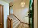 Inviting foyer with a chandelier, wood floors, and stairs leading to the upper level at 610 Coolsprings Ln, Woodstock, GA 30188