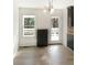 Cozy eat-in kitchen includes gray cabinets, outdoor access and natural light at 610 Coolsprings Ln, Woodstock, GA 30188