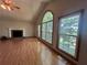 Spacious living room with fireplace and large windows offering lots of natural light at 610 Coolsprings Ln, Woodstock, GA 30188