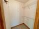 Walk-in closet featuring shelving for clothing and accessories at 610 Coolsprings Ln, Woodstock, GA 30188