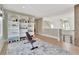 Versatile bonus room featuring built-in bookshelves and plenty of natural light offers space for recreation or relaxation at 150 Ray Way, Chattahoochee Hills, GA 30268