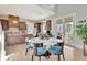 Charming dining area with hardwood floors and access to a patio makes for a bright and inviting place for Gathering gatherings at 150 Ray Way, Chattahoochee Hills, GA 30268