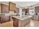 Modern kitchen features stainless steel appliances, granite countertops, and custom cabinetry for a chef-inspired cooking experience at 150 Ray Way, Chattahoochee Hills, GA 30268