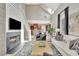 Bright living room with vaulted ceilings, fireplace, and hardwood floors offers a cozy and stylish space for relaxation at 150 Ray Way, Chattahoochee Hills, GA 30268