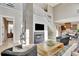Stunning living room with high ceilings, stone fireplace, and open floor plan offers a modern and spacious entertaining area at 150 Ray Way, Chattahoochee Hills, GA 30268