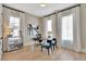 Bright and airy home office with large windows and hardwood floors provides a comfortable and productive workspace at 150 Ray Way, Chattahoochee Hills, GA 30268