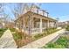 Charming home with a covered porch, offering a relaxing outdoor space at 150 Ray Way, Chattahoochee Hills, GA 30268