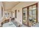 Charming screened porch with brick flooring, outdoor seating, and natural light at 150 Ray Way, Chattahoochee Hills, GA 30268