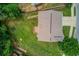 A private backyard space with lush green grass and a deck, surrounded by mature trees, offers a serene outdoor space at 1727 Shire Village Dr, Sugar Hill, GA 30518