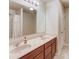 Bathroom featuring a double vanity, large mirror, and a shower with curtain at 1727 Shire Village Dr, Sugar Hill, GA 30518