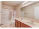 Bathroom featuring double sinks, a toilet, and a shower with curtain at 1727 Shire Village Dr, Sugar Hill, GA 30518
