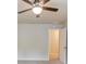 Bedroom featuring a ceiling fan and doorway providing natural light and ample closet space at 1727 Shire Village Dr, Sugar Hill, GA 30518