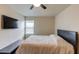 Bedroom featuring a bed, window, tv and desk at 1727 Shire Village Dr, Sugar Hill, GA 30518