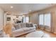 Open-concept living space with hardwood floors, light colored walls, and natural lighting at 1727 Shire Village Dr, Sugar Hill, GA 30518