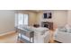 Comfortable living room with light walls, wood floors, and stylish decor at 1727 Shire Village Dr, Sugar Hill, GA 30518